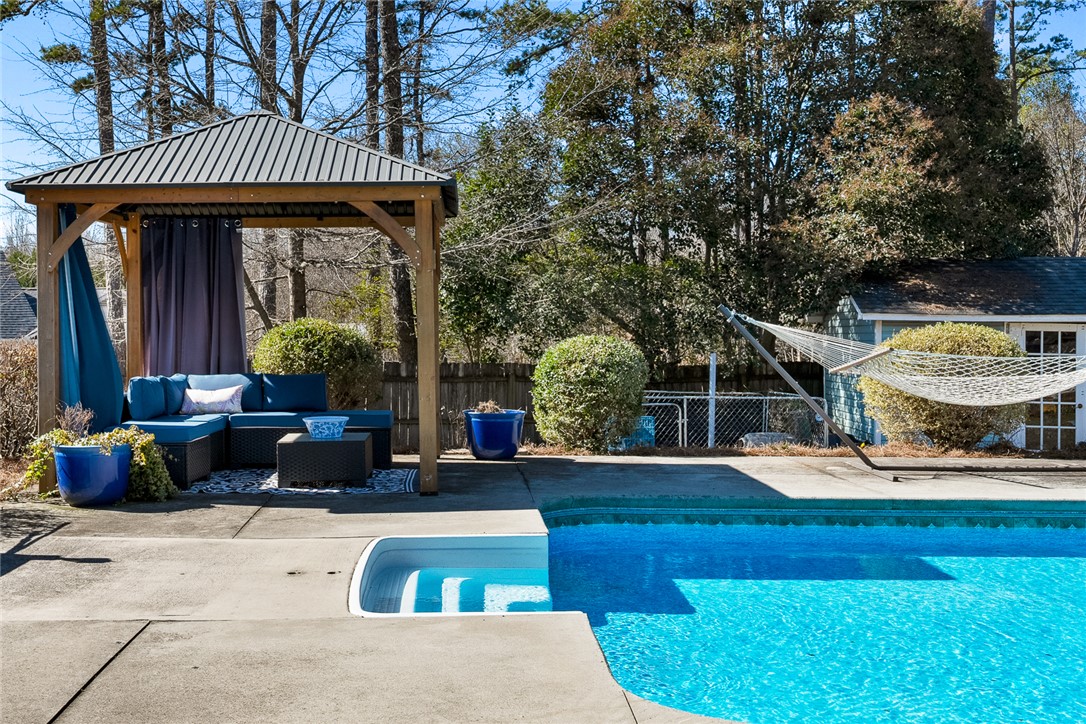 112 C-10-220 Anderson, SC 29621 - Photo 43 of 45 Enjoy outdoor living with a private pool and a shaded gazebo, perfect for relaxation.