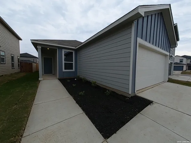 a back view of house along with yard