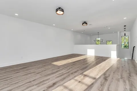 a kitchen with granite countertop a sink stove and cabinets