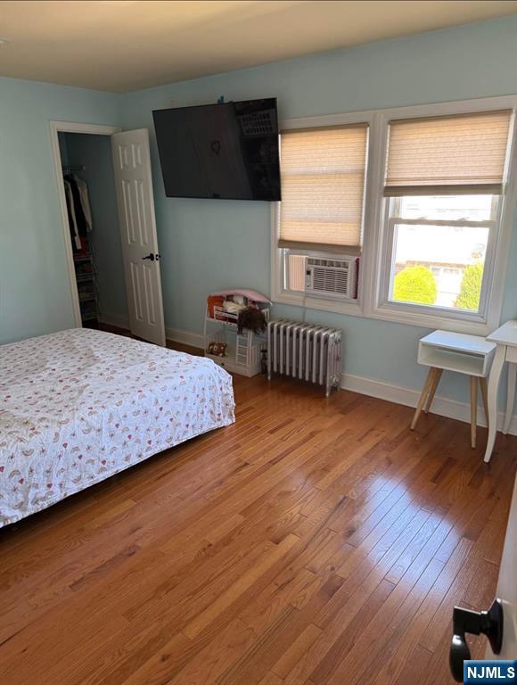 380 Semel Avenue Garfield, NJ 07026 - Photo 17 of 19 a bedroom with a bed and a table in it