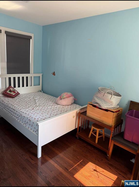 380 Semel Avenue Garfield, NJ 07026 - Photo 18 of 19 a bedroom with a bed and a flat screen tv