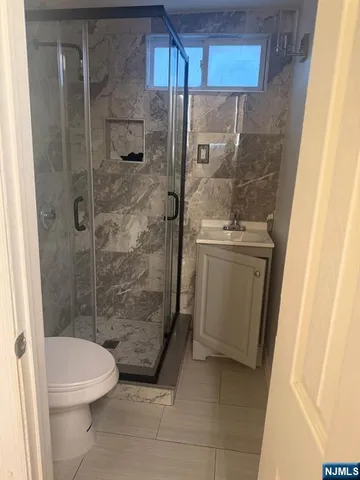 a bathroom with a shower and a toilet