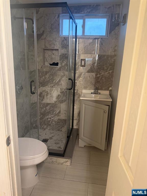 380 Semel Avenue Garfield, NJ 07026 - Photo 9 of 19 a bathroom with a shower and a toilet