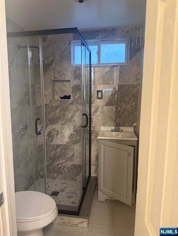 380 Semel Avenue Garfield, NJ 07026 - Photo 10 of 19 a bathroom with a granite countertop sink toilet and shower