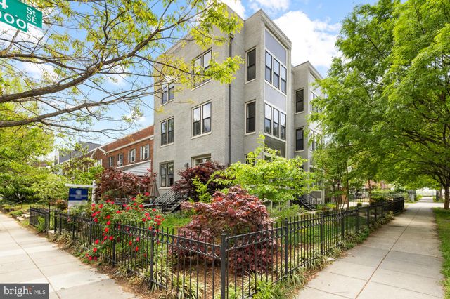 a front view of a multi story residential apartment buildings