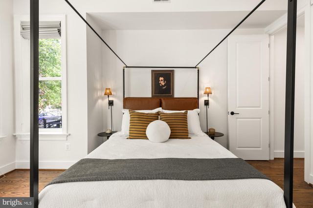 a bedroom with a bed and window