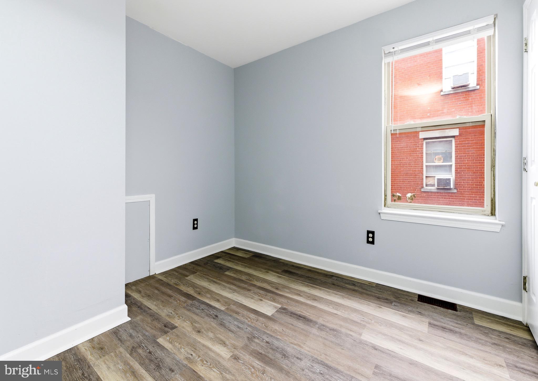 576 Washington Street Camden, NJ 08103 - Photo 13 of 25 a view of a room with wooden floor and closet