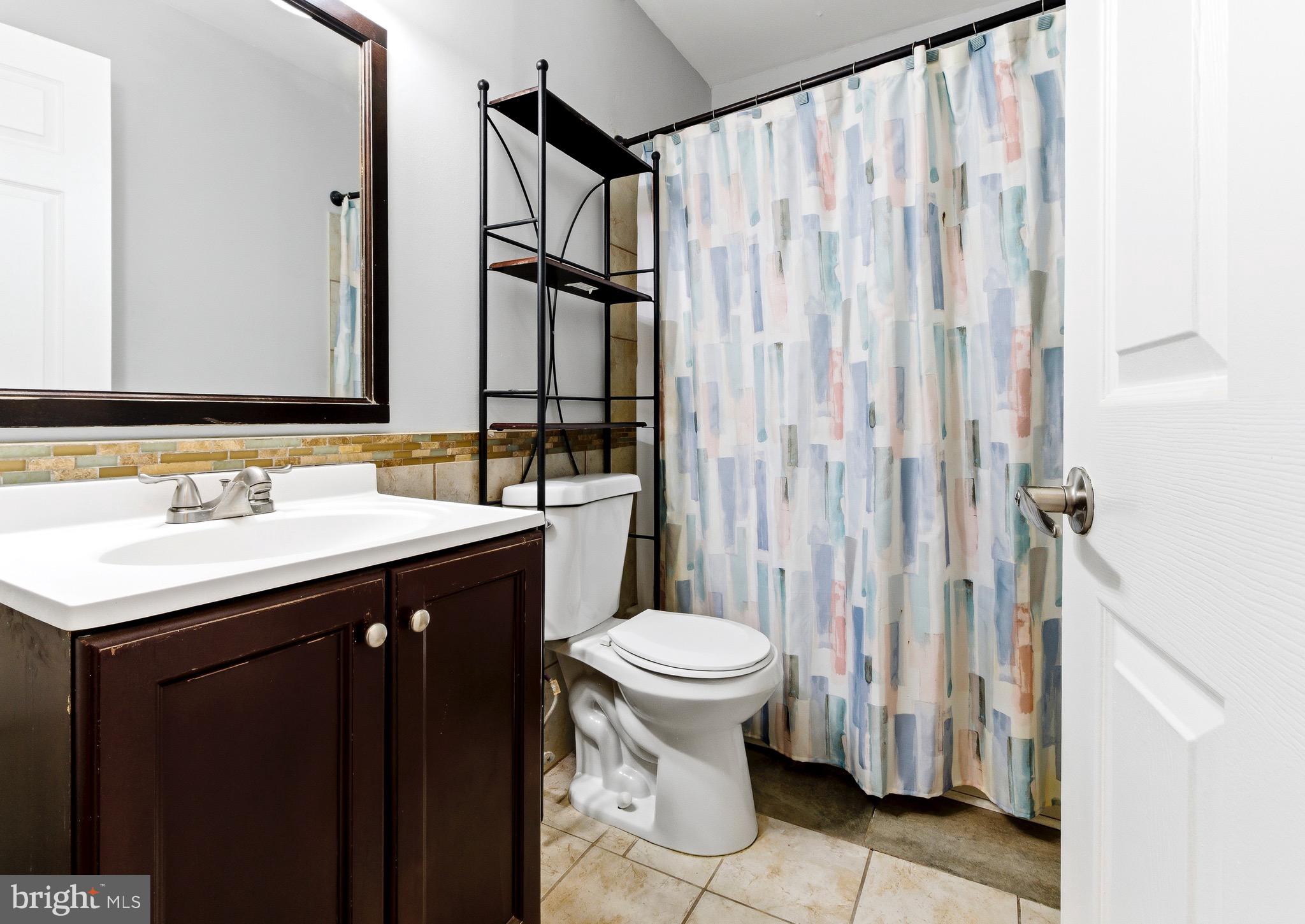 576 Washington Street Camden, NJ 08103 - Photo 19 of 25 a bathroom with a sink and a toilet