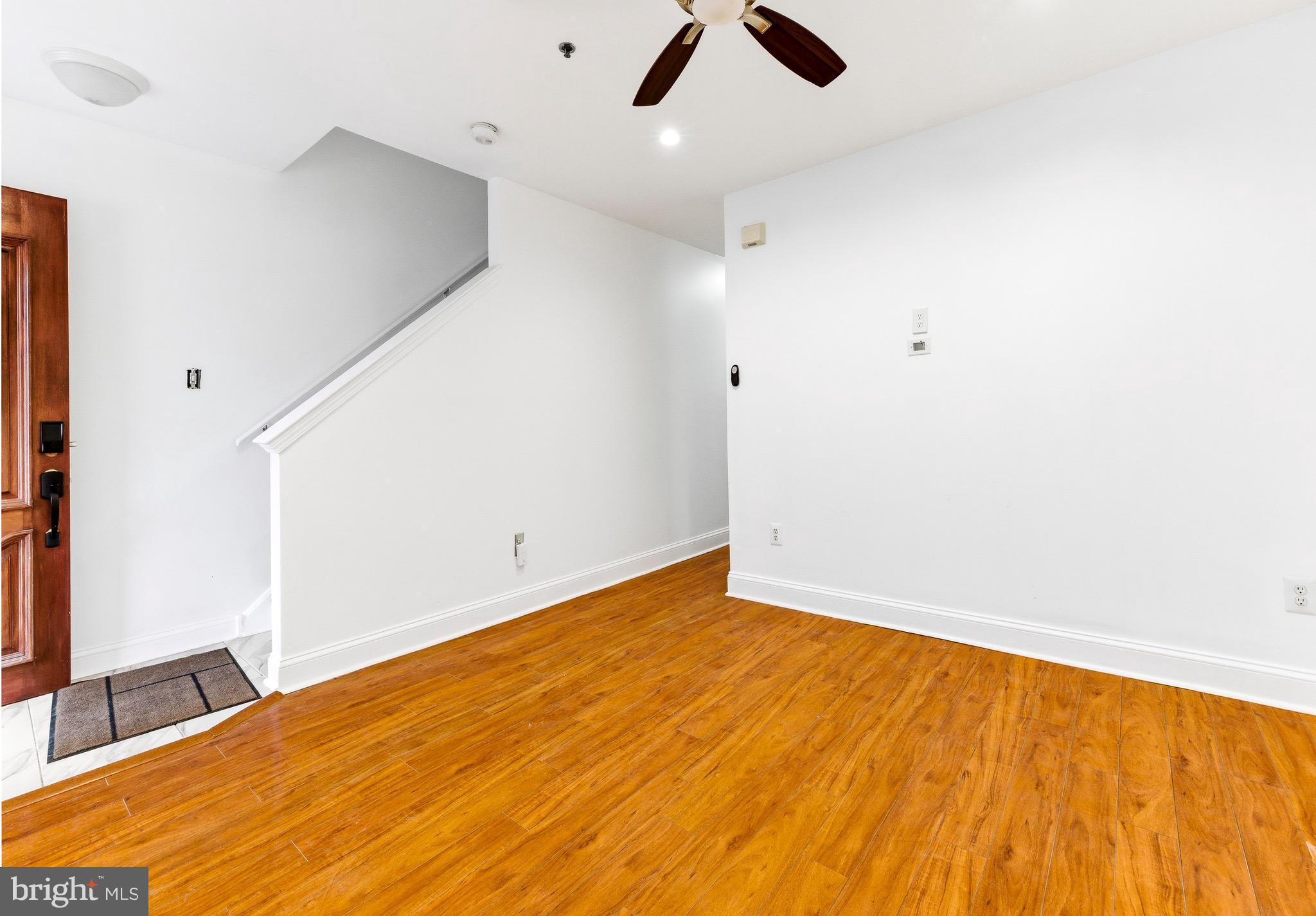 576 Washington Street Camden, NJ 08103 - Photo 4 of 25 wooden floor in an empty room