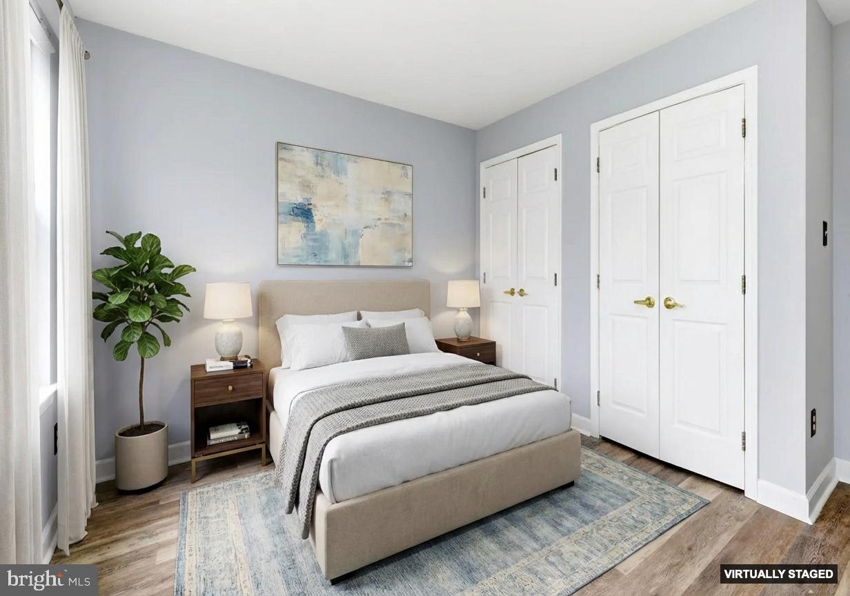 576 Washington Street Camden, NJ 08103 - Photo 6 of 25 a bedroom with a bed and a potted plant