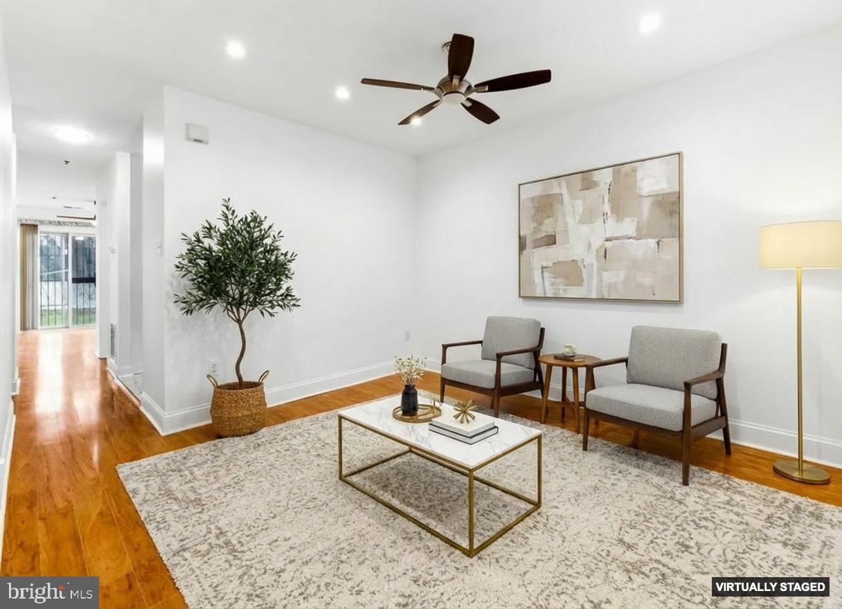 576 Washington Street Camden, NJ 08103 - Photo 8 of 25 a living room with furniture and a rug