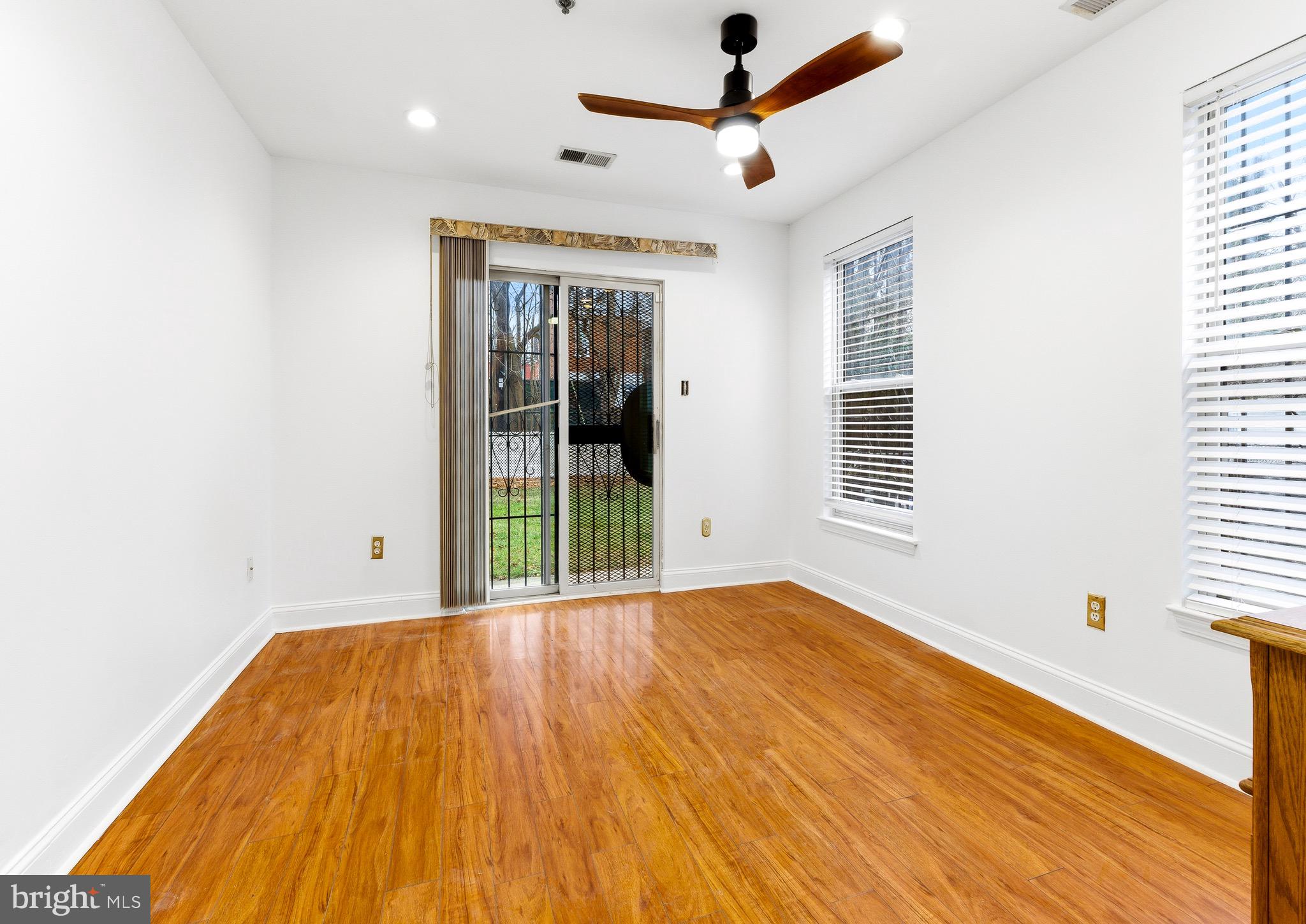 576 Washington Street Camden, NJ 08103 - Photo 9 of 25 wooden floor in an empty room with a window