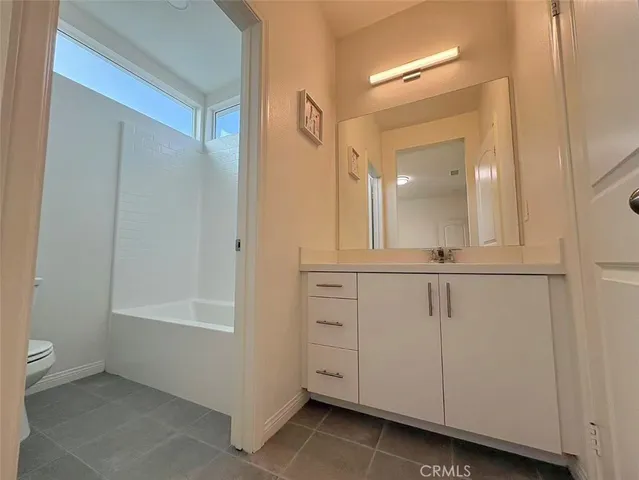 a view of a bathroom with mirror