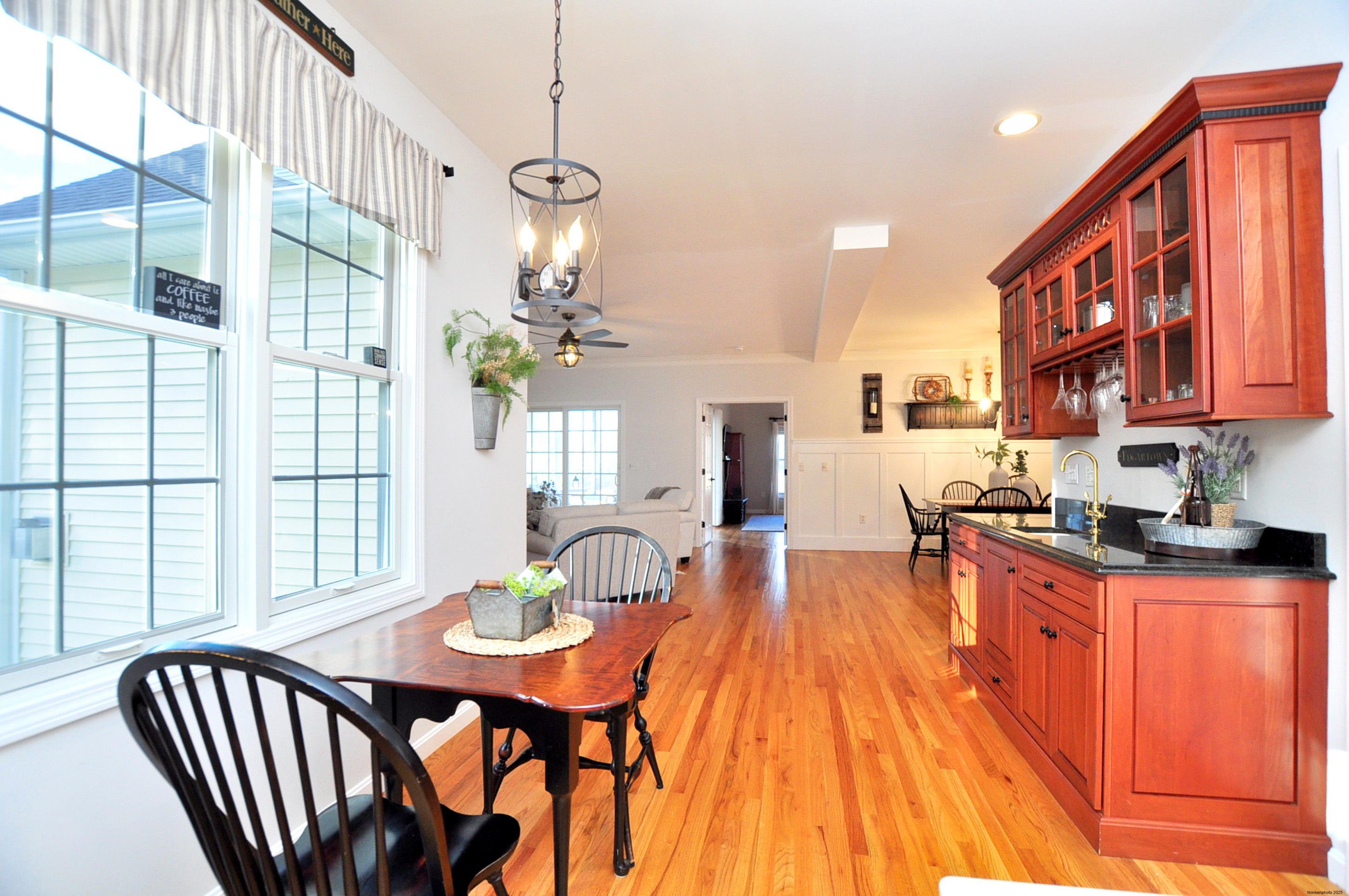 23 Dewberry Court, Unit 23 Suffield, CT 06078 - Photo 12 of 40 a view of a dining room with furniture a chandelier and wooden floor