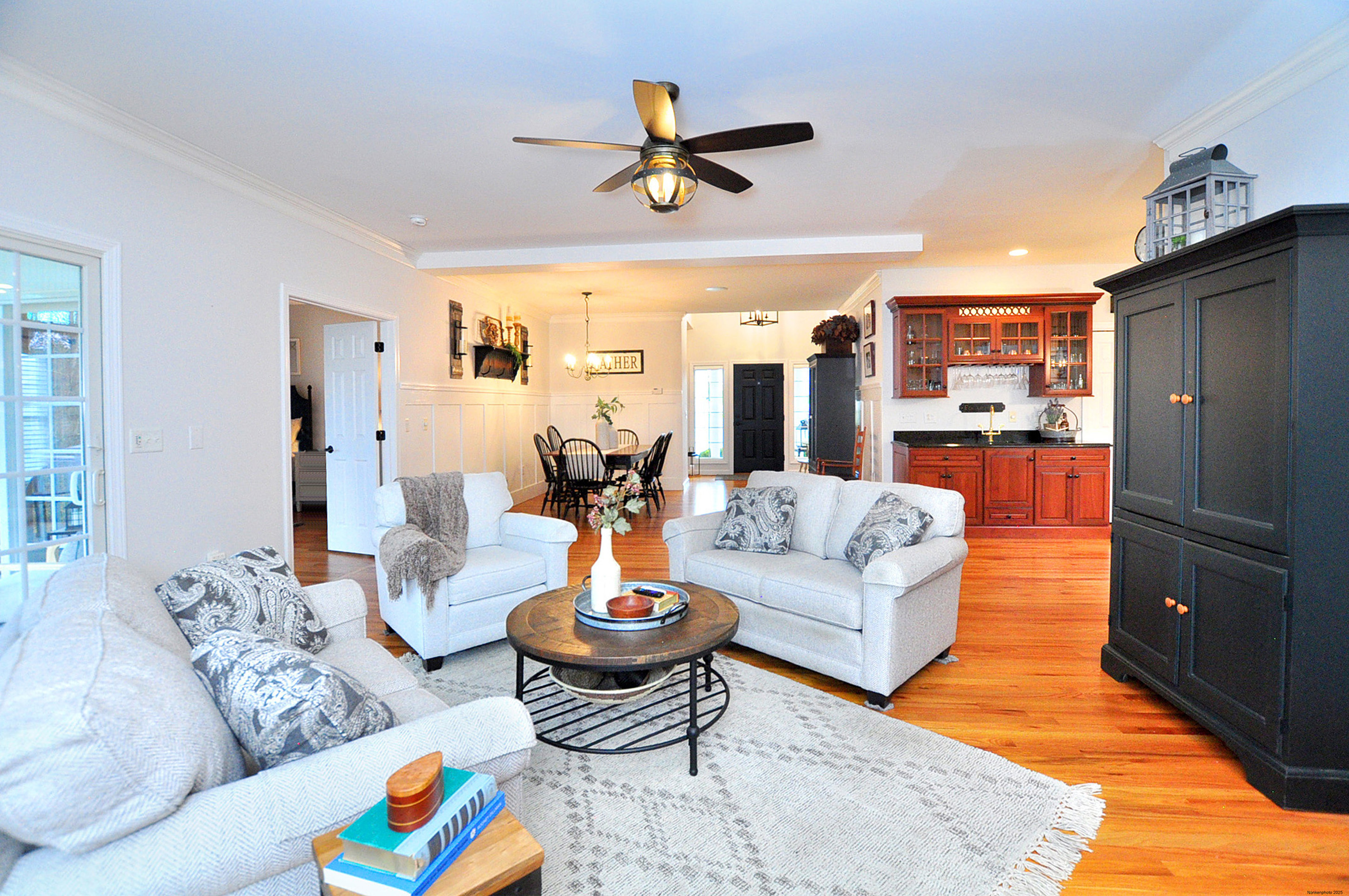 23 Dewberry Court, Unit 23 Suffield, CT 06078 - Photo 20 of 40 a living room with furniture kitchen view and a chandelier
