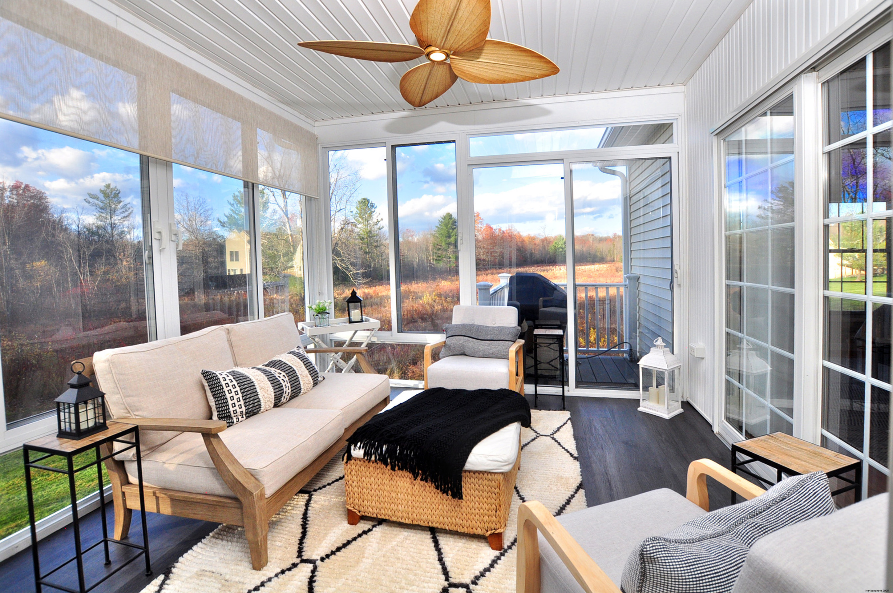 23 Dewberry Court, Unit 23 Suffield, CT 06078 - Photo 23 of 40 a living room with furniture and a floor to ceiling window