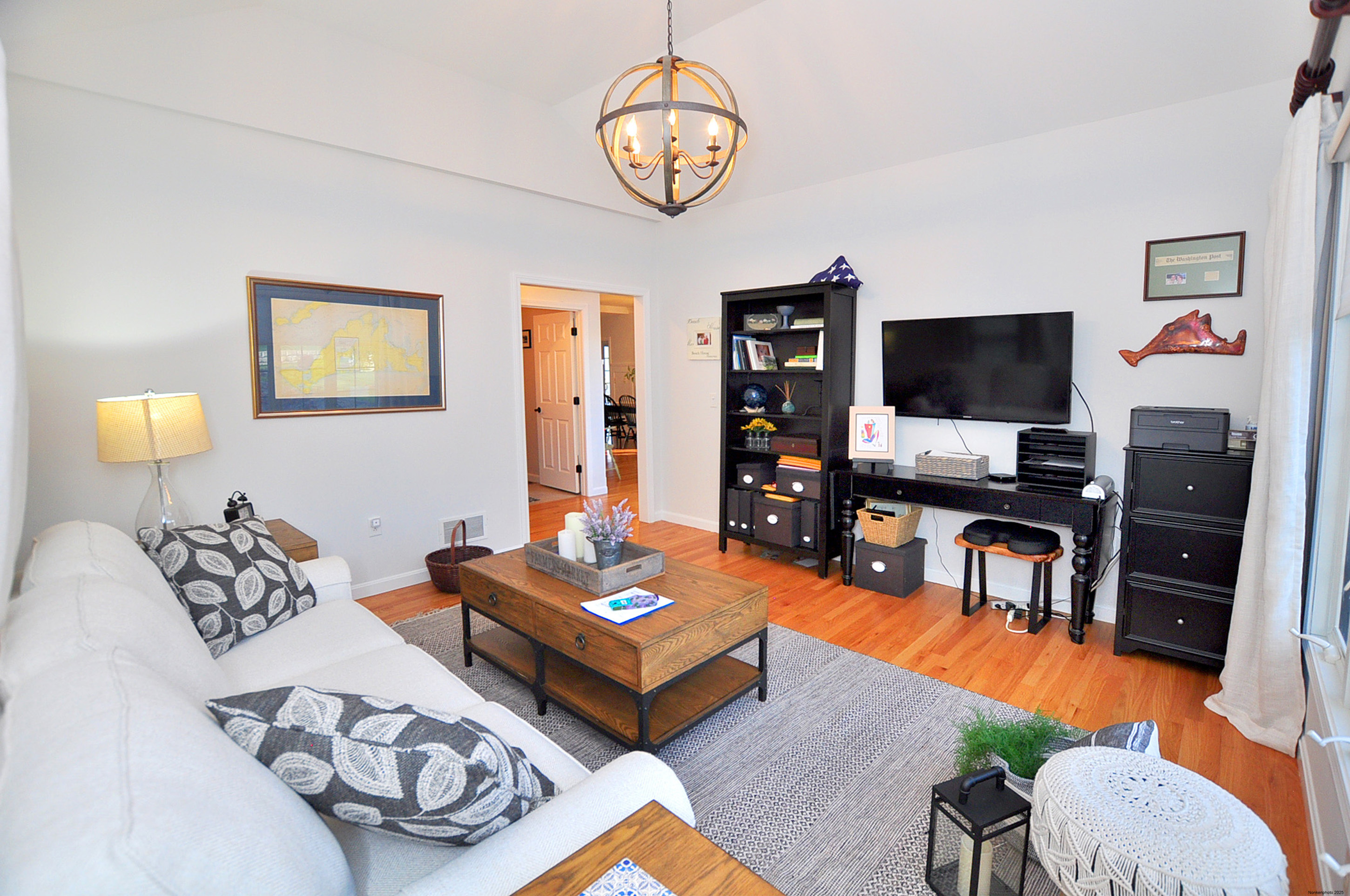 23 Dewberry Court, Unit 23 Suffield, CT 06078 - Photo 29 of 40 a living room with furniture a rug and a flat screen tv