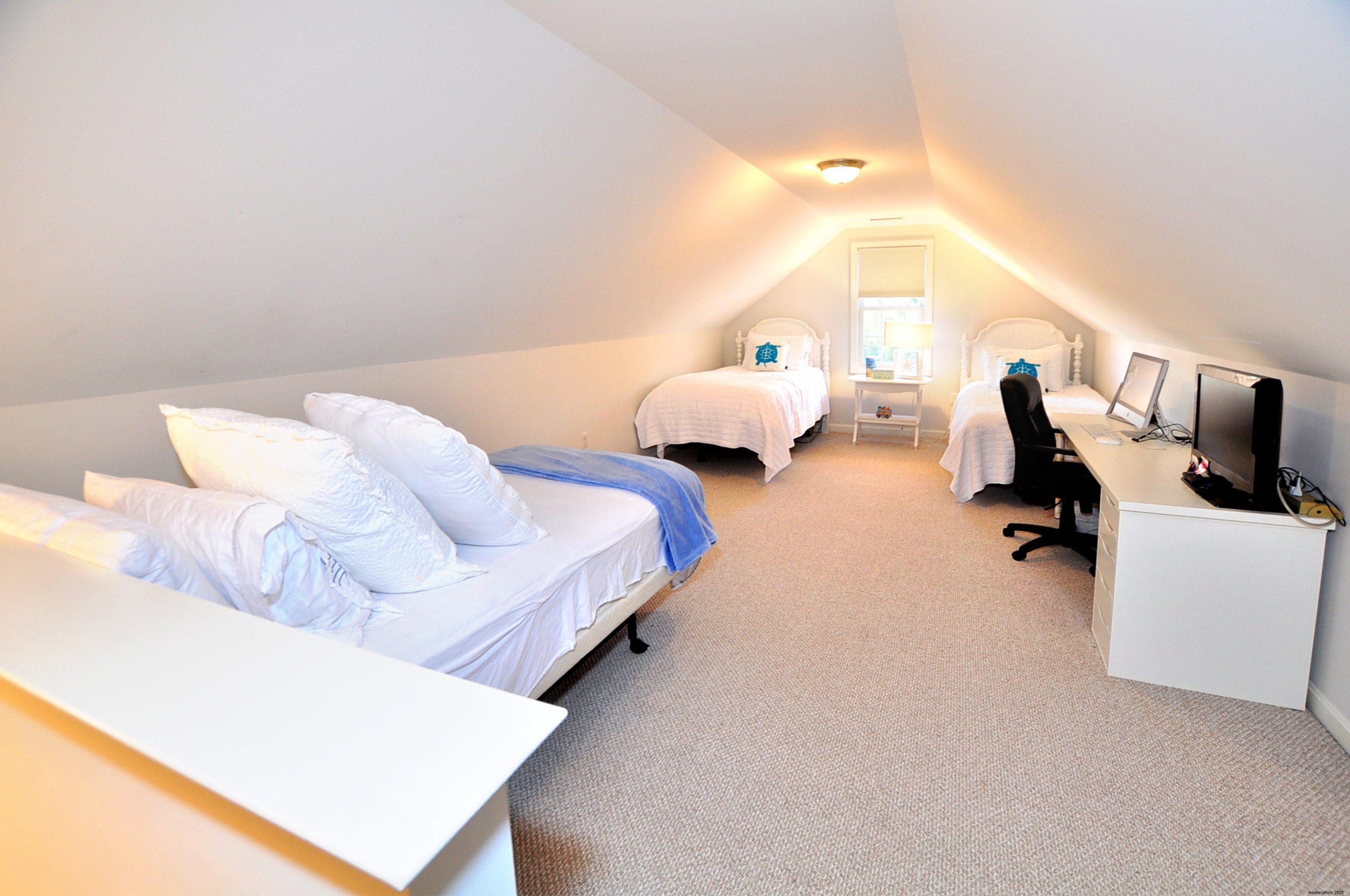 23 Dewberry Court, Unit 23 Suffield, CT 06078 - Photo 36 of 40 a bed room with two bed and a night stand