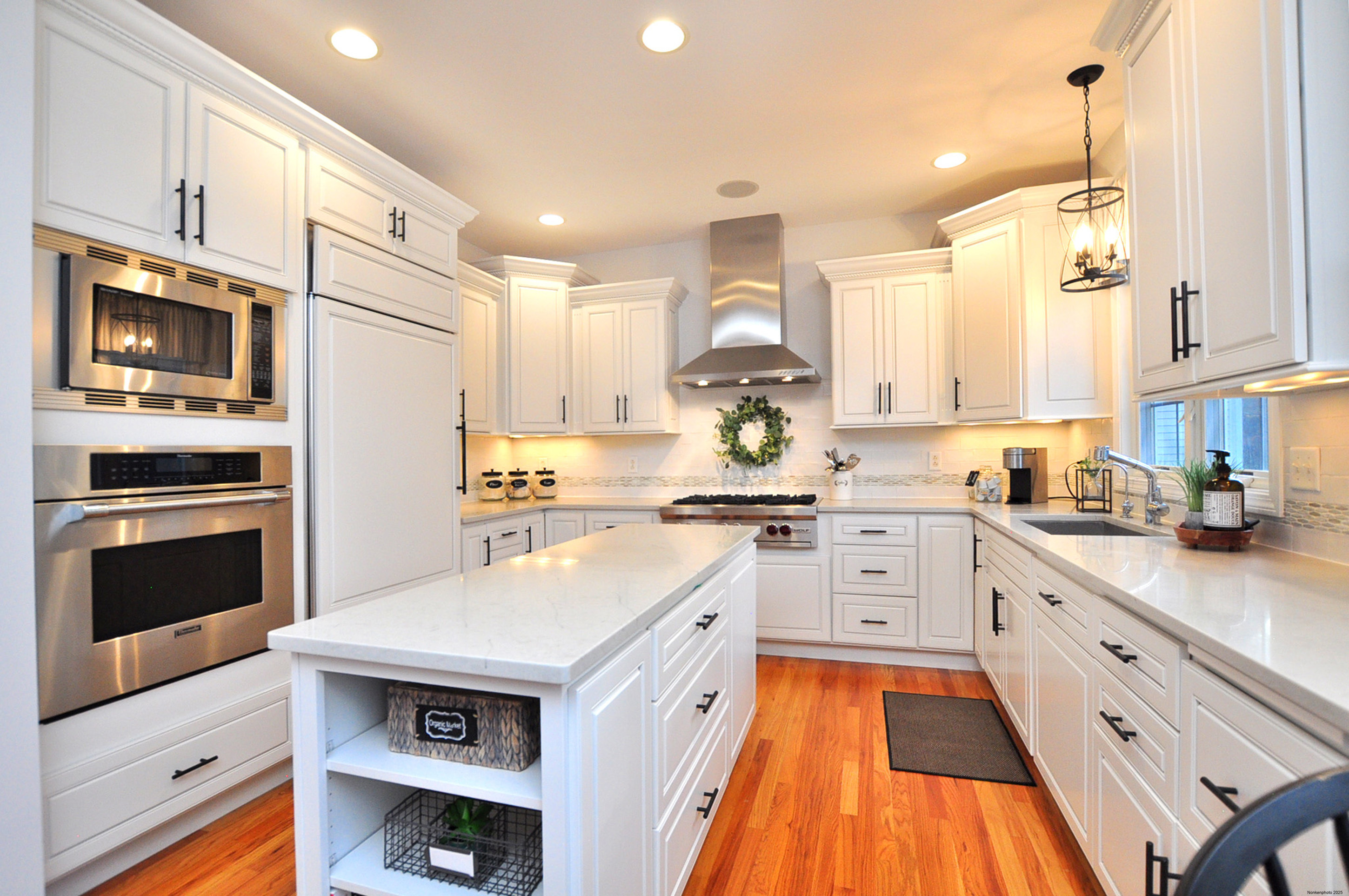 23 Dewberry Court, Unit 23 Suffield, CT 06078 - Photo 5 of 40 a kitchen with stainless steel appliances a stove sink and cabinets