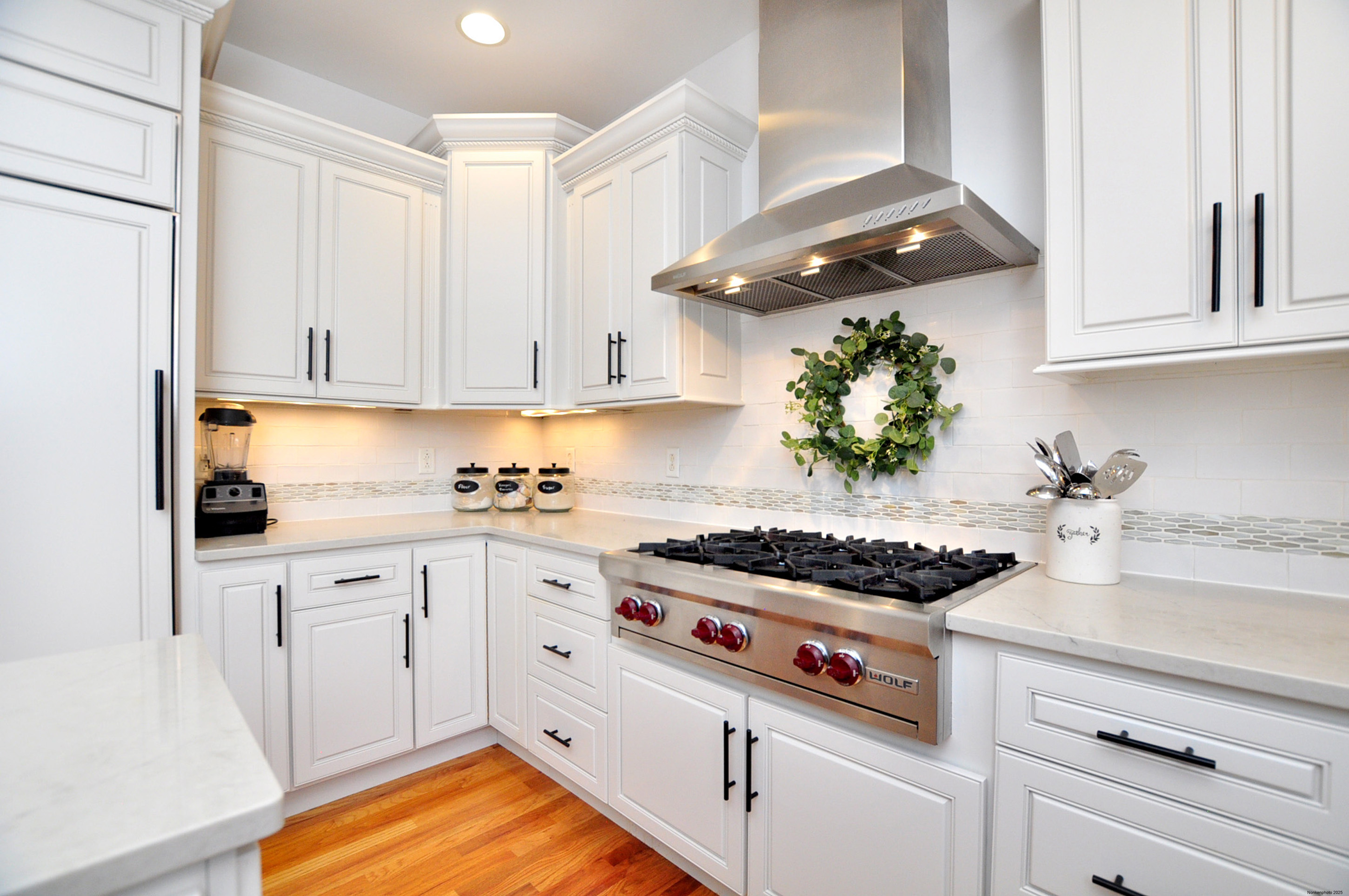 23 Dewberry Court, Unit 23 Suffield, CT 06078 - Photo 6 of 40 a kitchen with stainless steel appliances granite countertop a stove and a white cabinets
