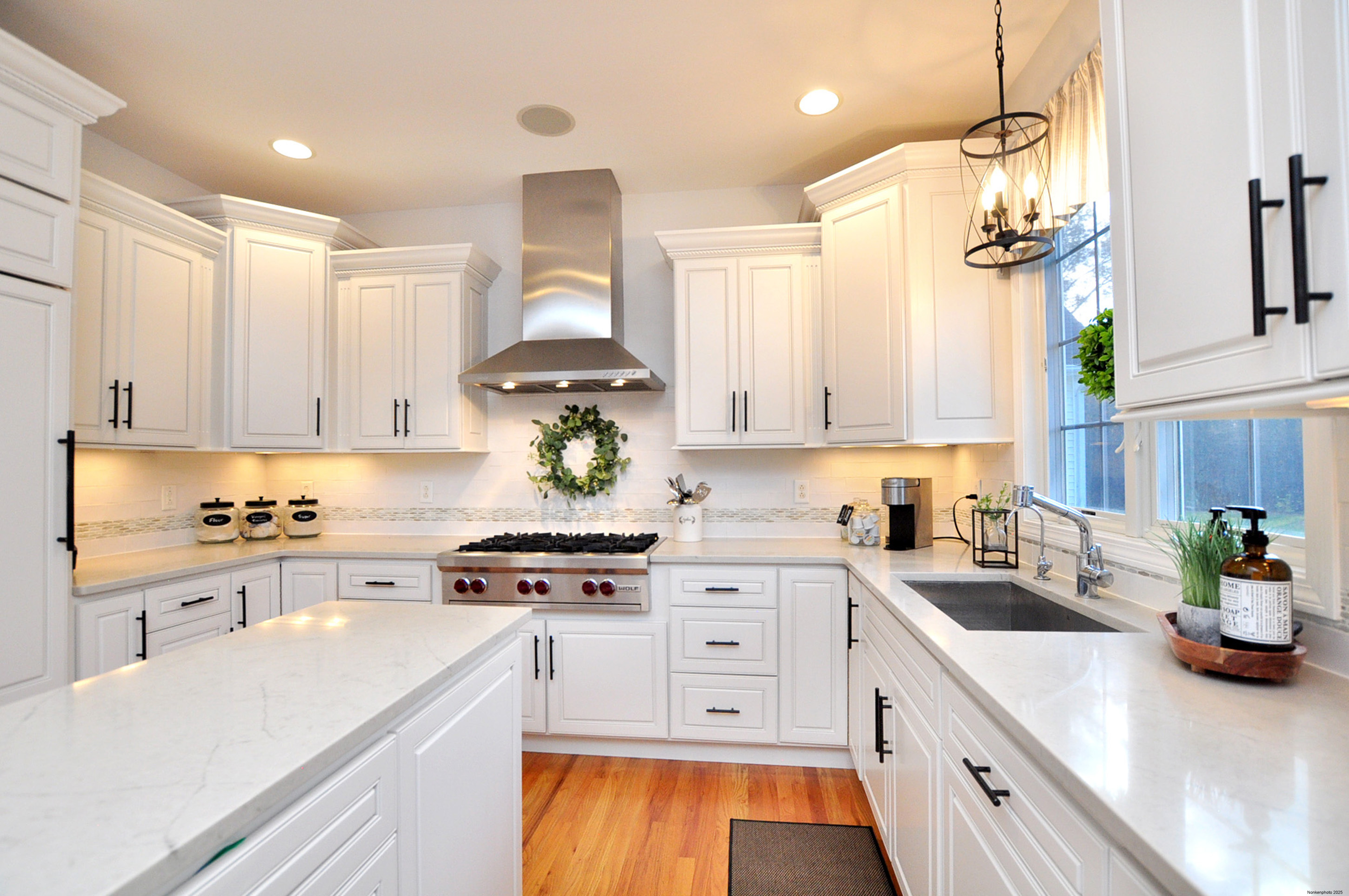 23 Dewberry Court, Unit 23 Suffield, CT 06078 - Photo 9 of 40 a kitchen with stainless steel appliances a sink a stove a refrigerator and cabinets