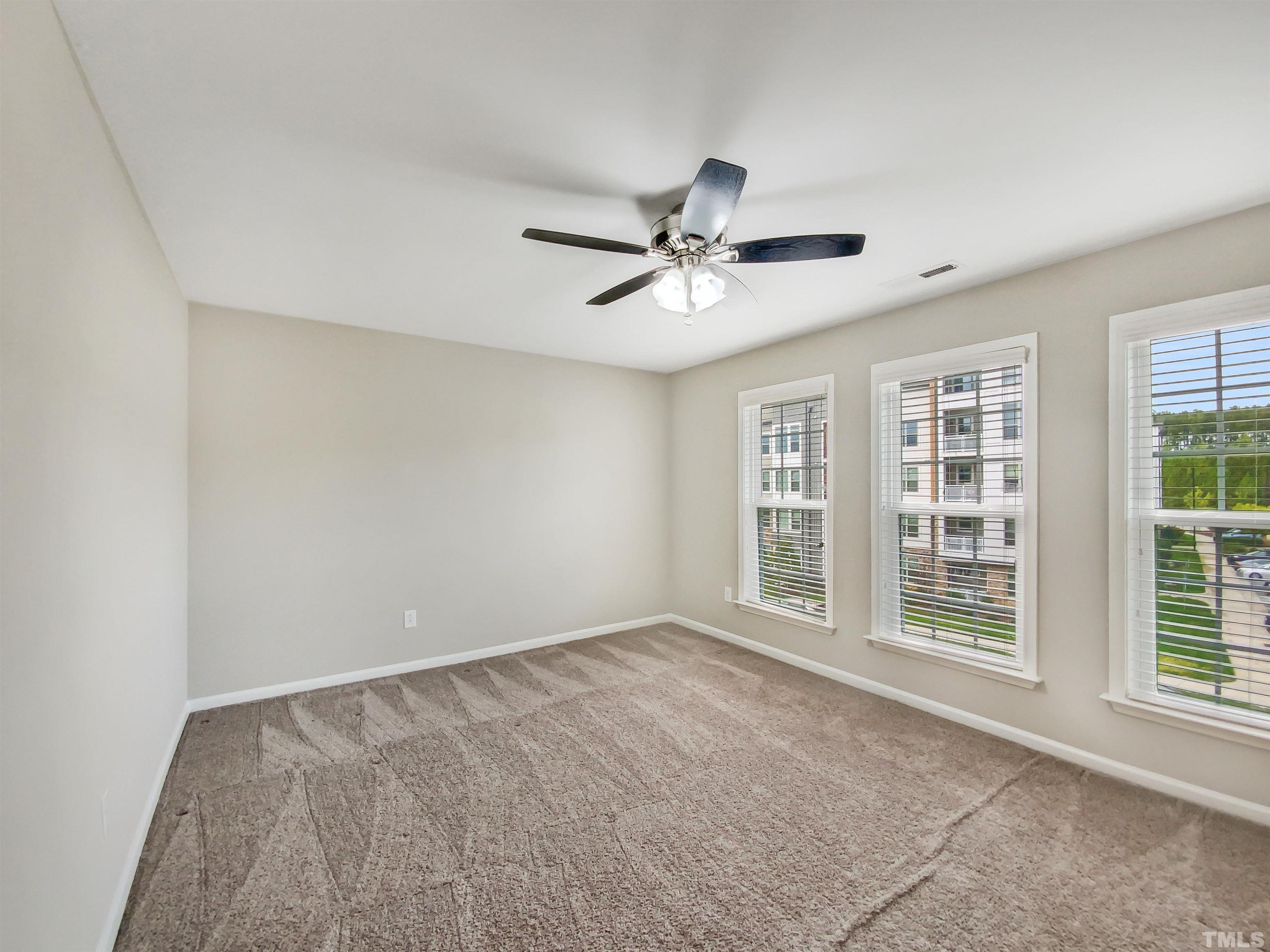 7006 Reedybrook Crossing Apex, NC 27523 - Photo 14 of 18 a view of an empty room with a window