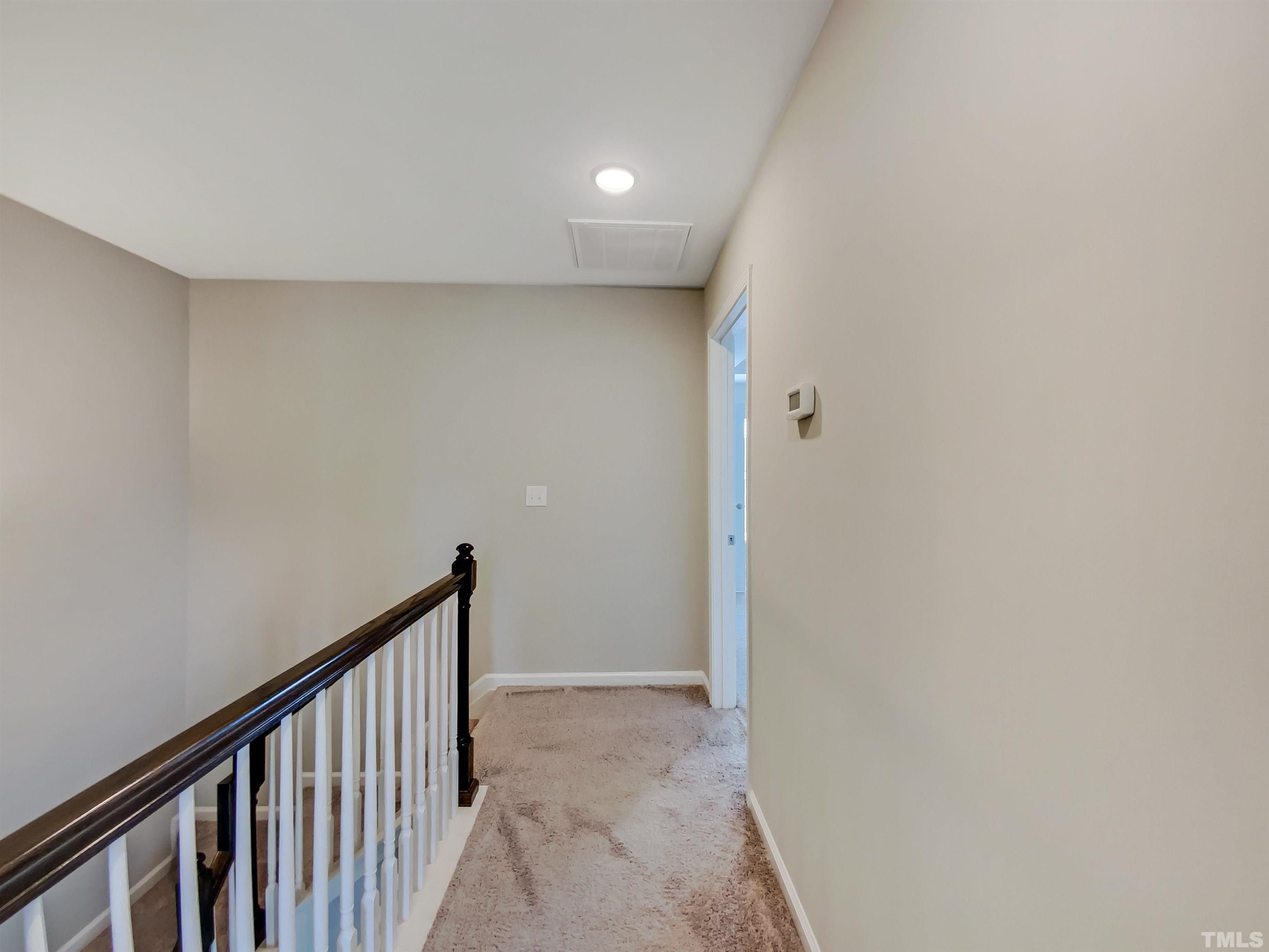 7006 Reedybrook Crossing Apex, NC 27523 - Photo 17 of 18 a view of a hallway