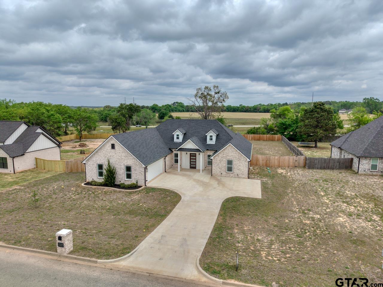 19383 Ridge Point Circle Lindale, TX 75771 - Photo 45 of 48 an aerial view of a house with a yard