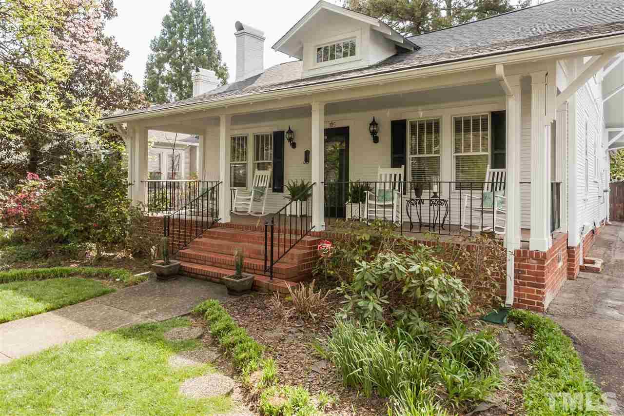 105 West Whitaker Mill Road Raleigh, NC 27608 - Photo 2 of 20 front view of a house with a chairs and table in a patio