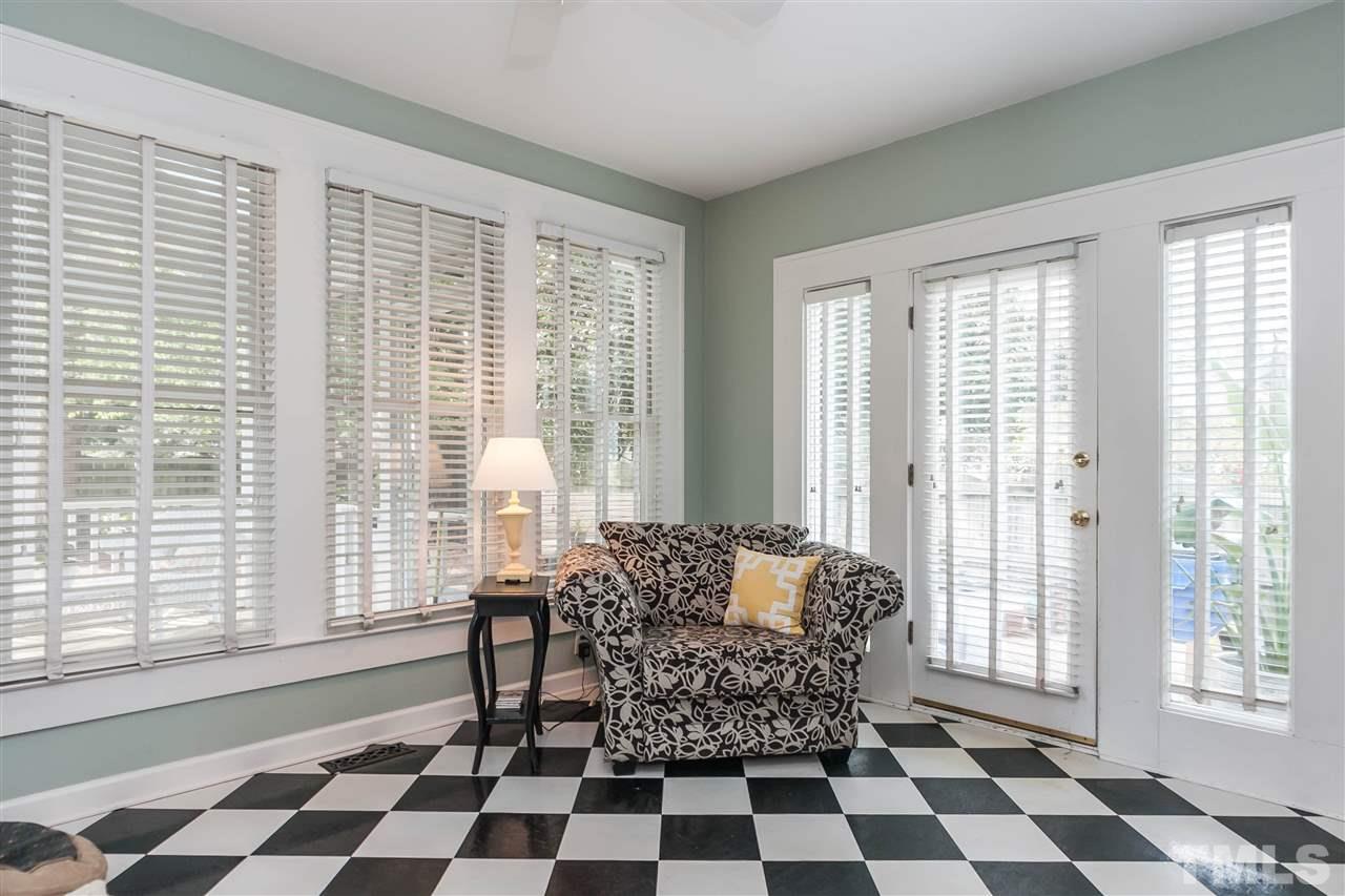 105 West Whitaker Mill Road Raleigh, NC 27608 - Photo 13 of 20 a room with a black and white checkered floor