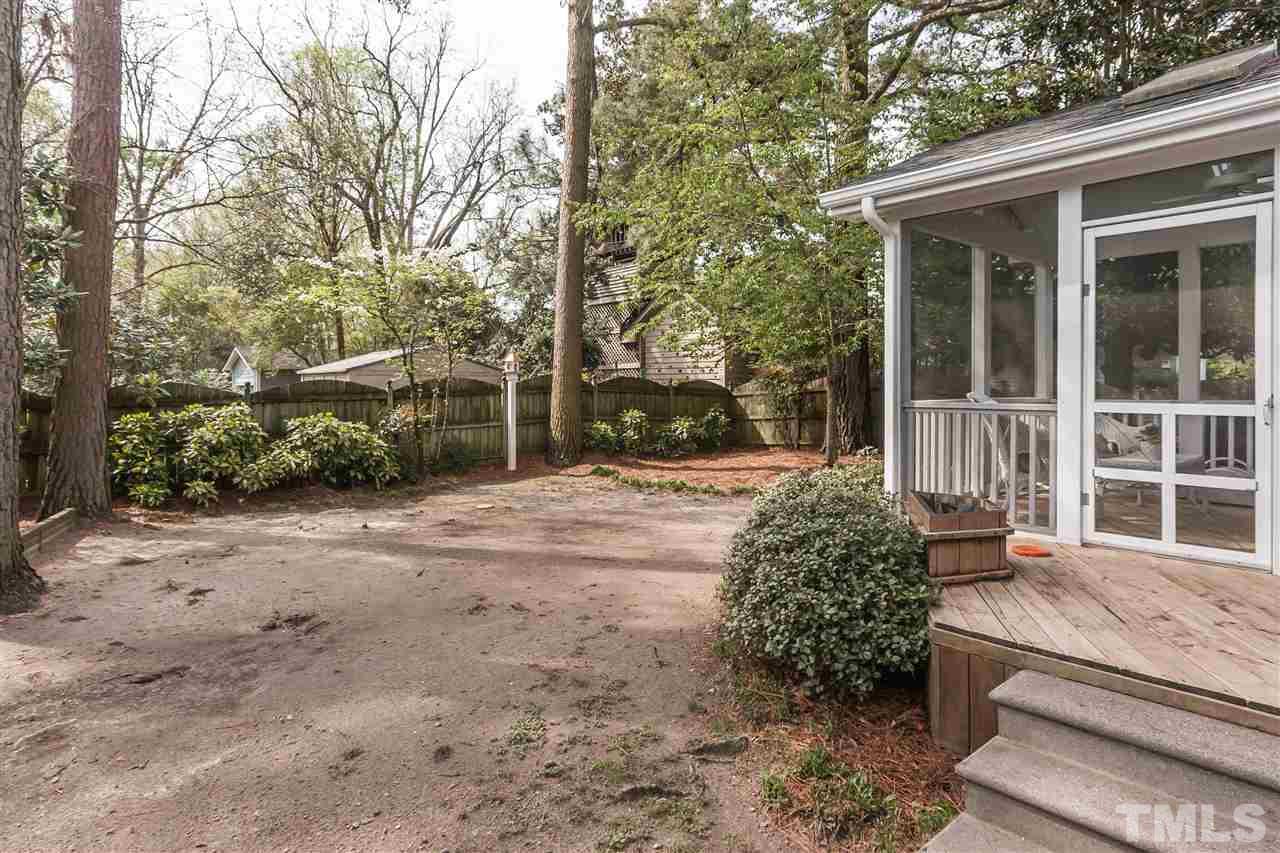 105 West Whitaker Mill Road Raleigh, NC 27608 - Photo 19 of 20 a view of a yard with a house and large tree