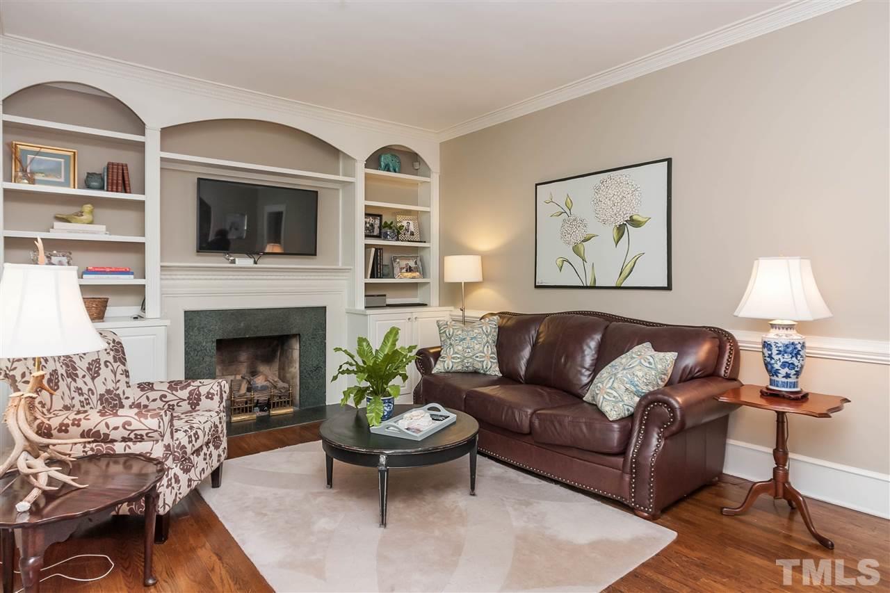 105 West Whitaker Mill Road Raleigh, NC 27608 - Photo 4 of 20 a living room with furniture fireplace and window