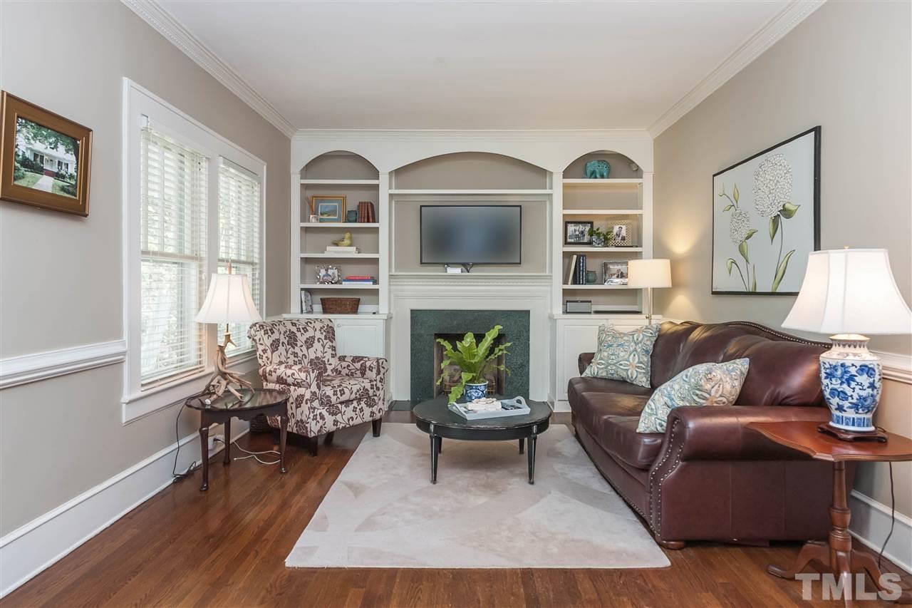 105 West Whitaker Mill Road Raleigh, NC 27608 - Photo 5 of 20 a living room with furniture and a fireplace
