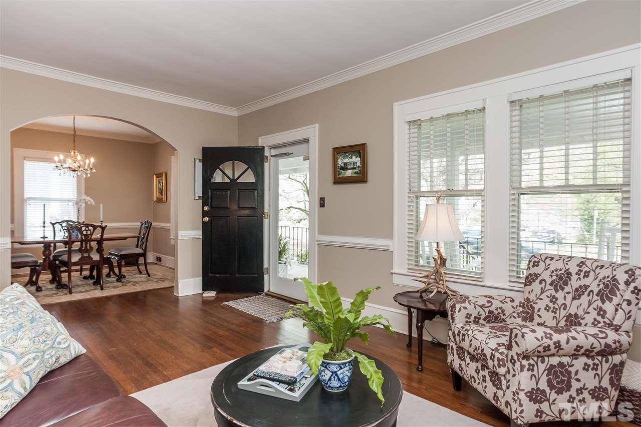 105 West Whitaker Mill Road Raleigh, NC 27608 - Photo 6 of 20 a living room with furniture and wooden floor