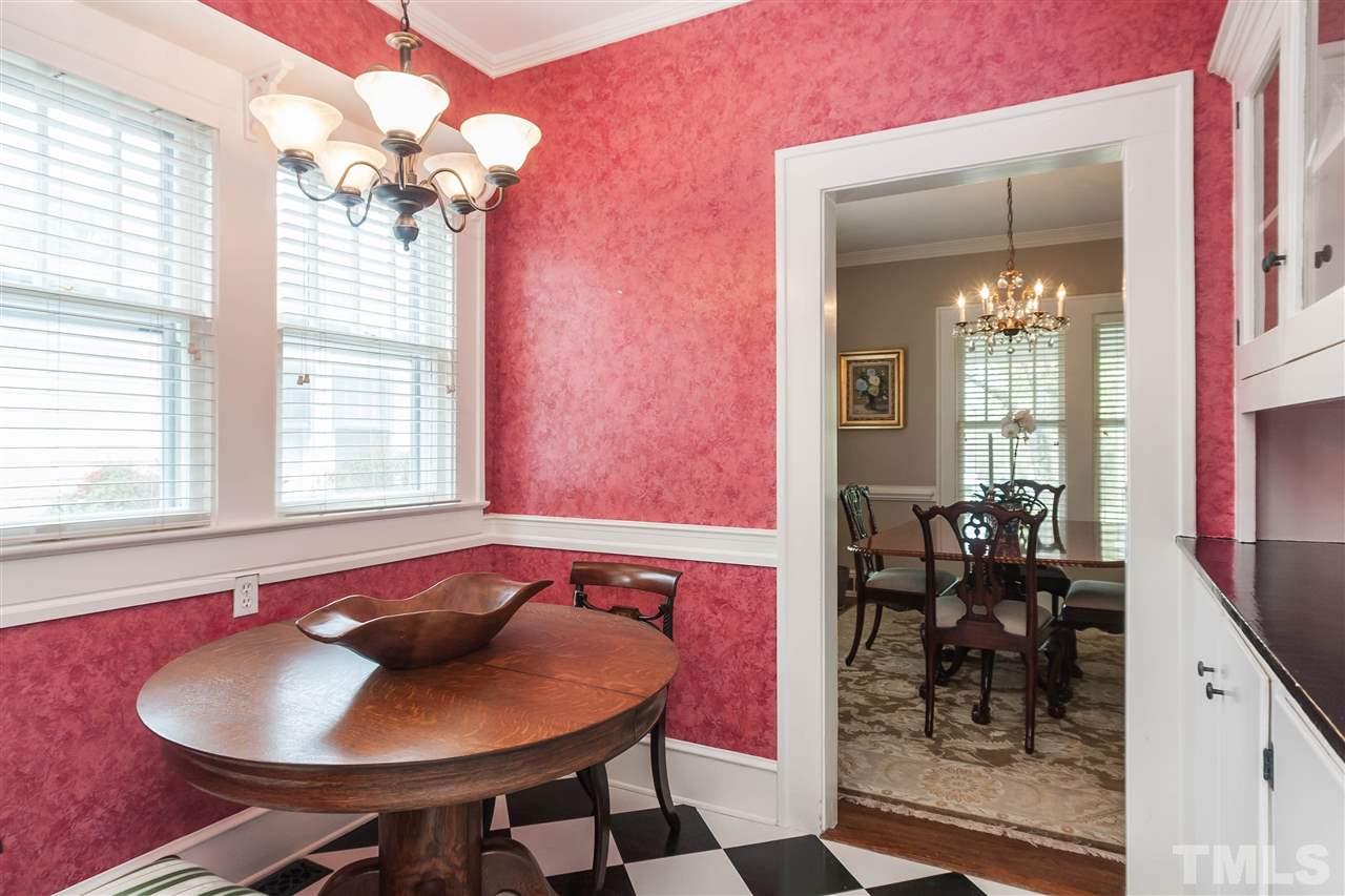 105 West Whitaker Mill Road Raleigh, NC 27608 - Photo 8 of 20 a view of a dining room with furniture and chandelier