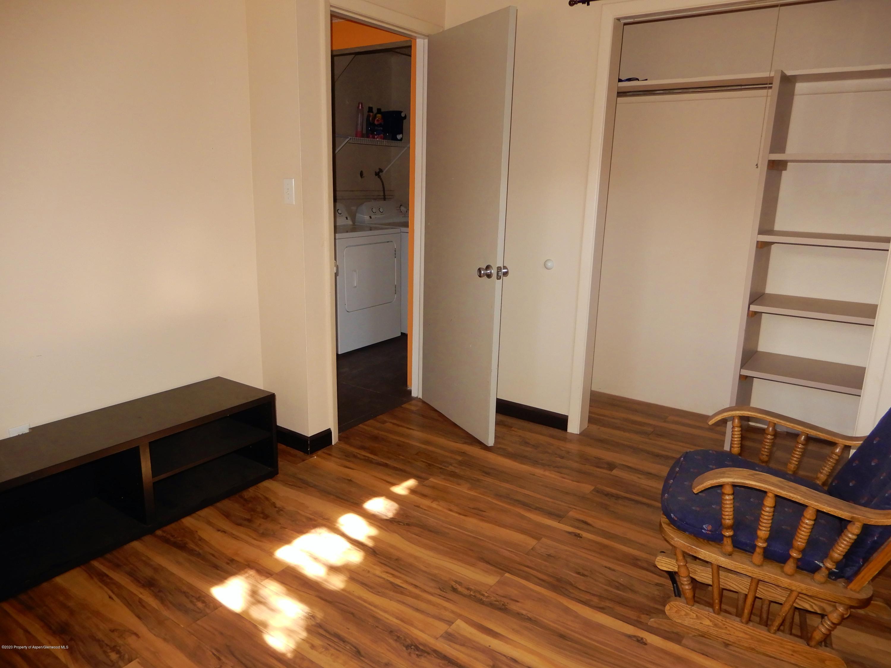 405 Hutton Avenue Rifle, CO 81650 - Photo 8 of 20 a view of walk in closet with empty racks