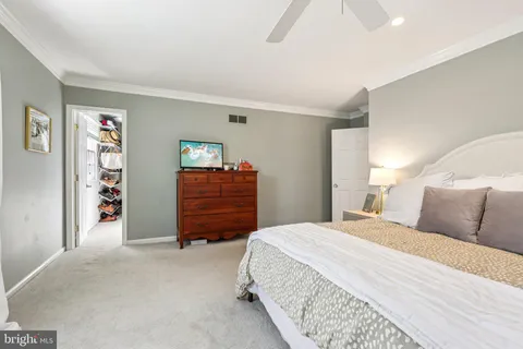 a bedroom with a bed and dresser