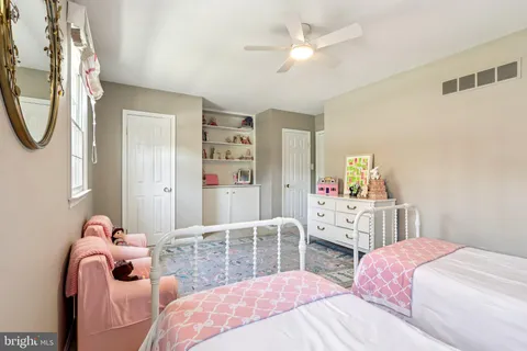 a bedroom with a bed and a cabinets