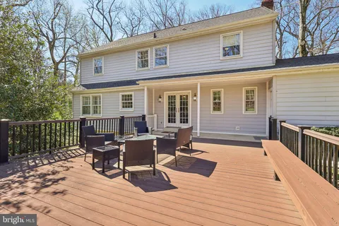 a view of a deck with wooden floor and outdoor seating
