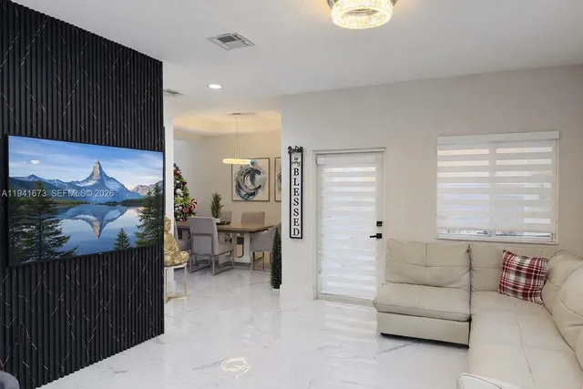 a living room with furniture and a window