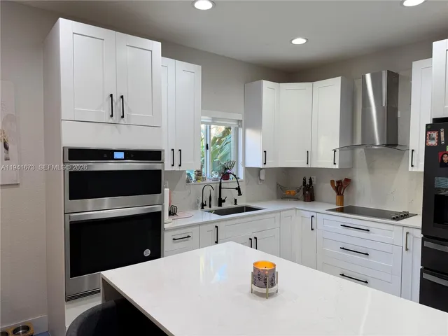 a bathroom with a sink toilet and window