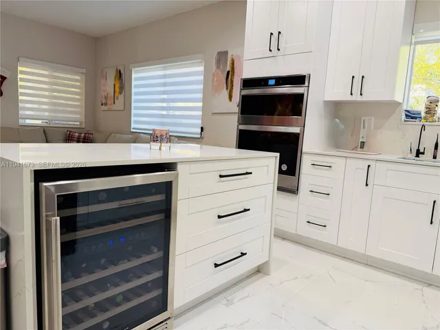 a bathroom with a shower and a glass door
