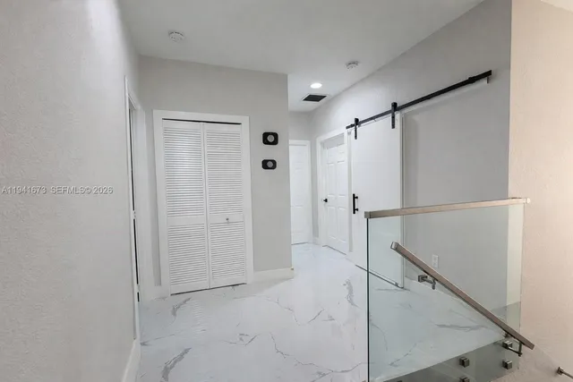 a bathroom with a shower sink and mirror