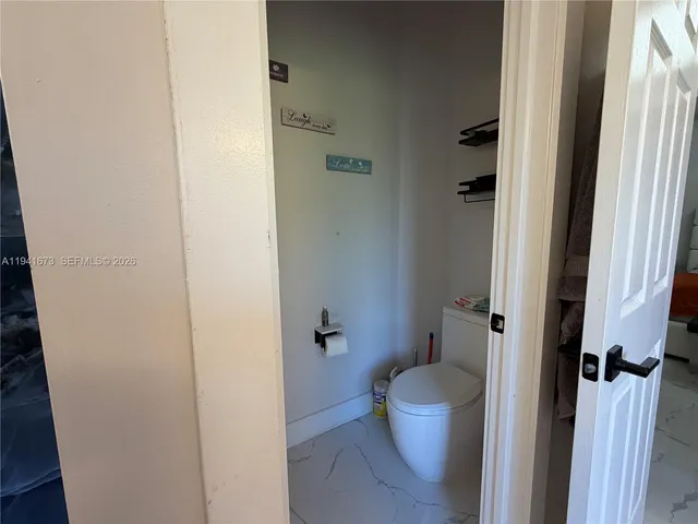 a kitchen with a stove and a refrigerator