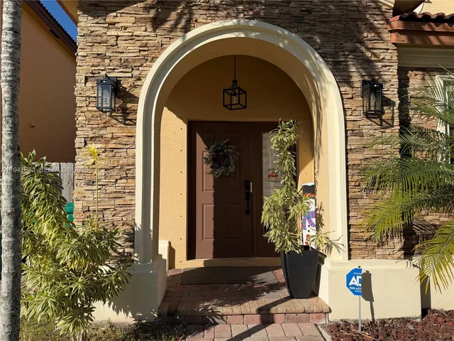 a living room with furniture and flowers