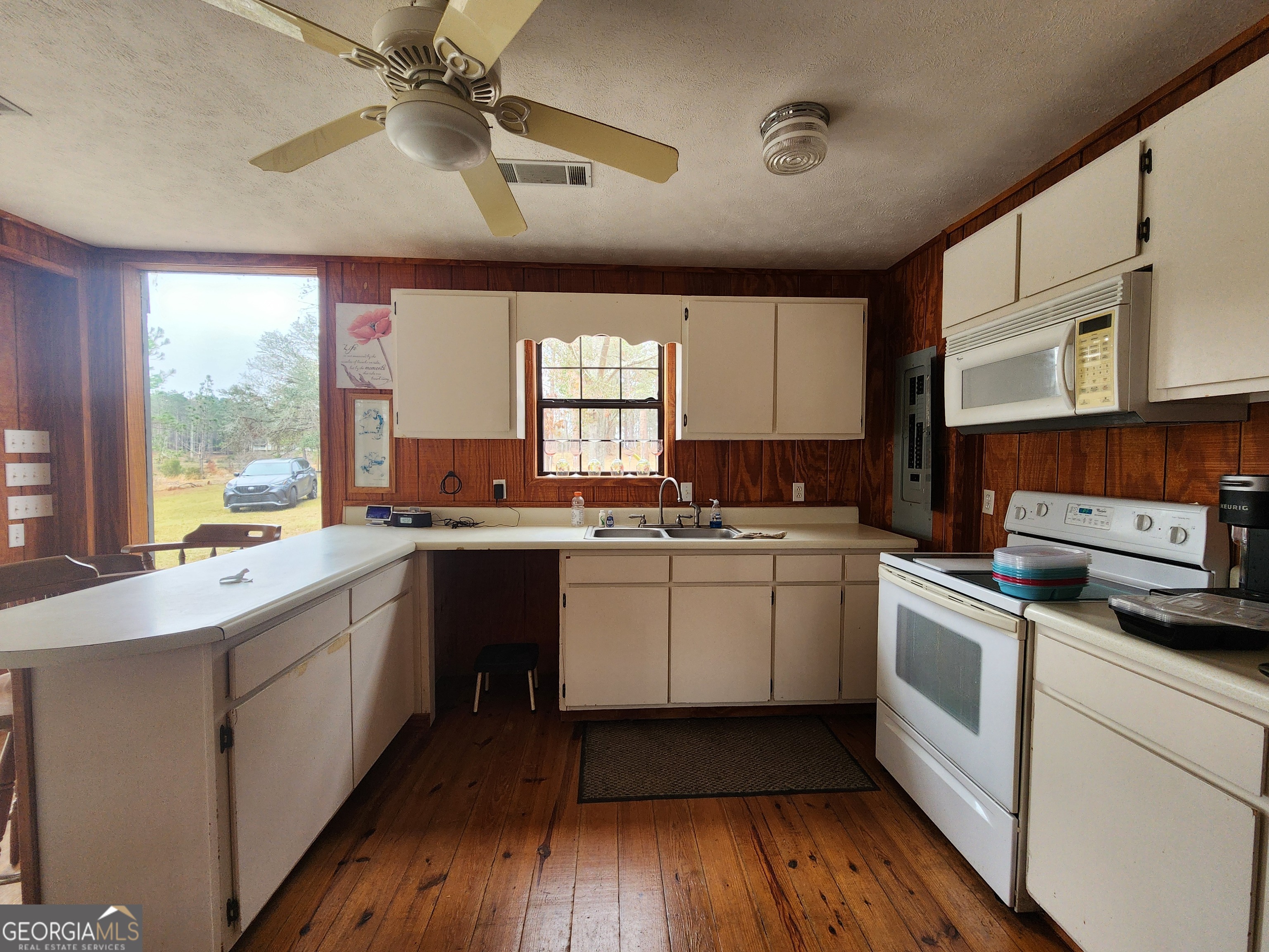 0 Hammond Powell Road Hazlehurst, GA 31539 - Photo 14 of 45 a kitchen with a sink window and cabinets