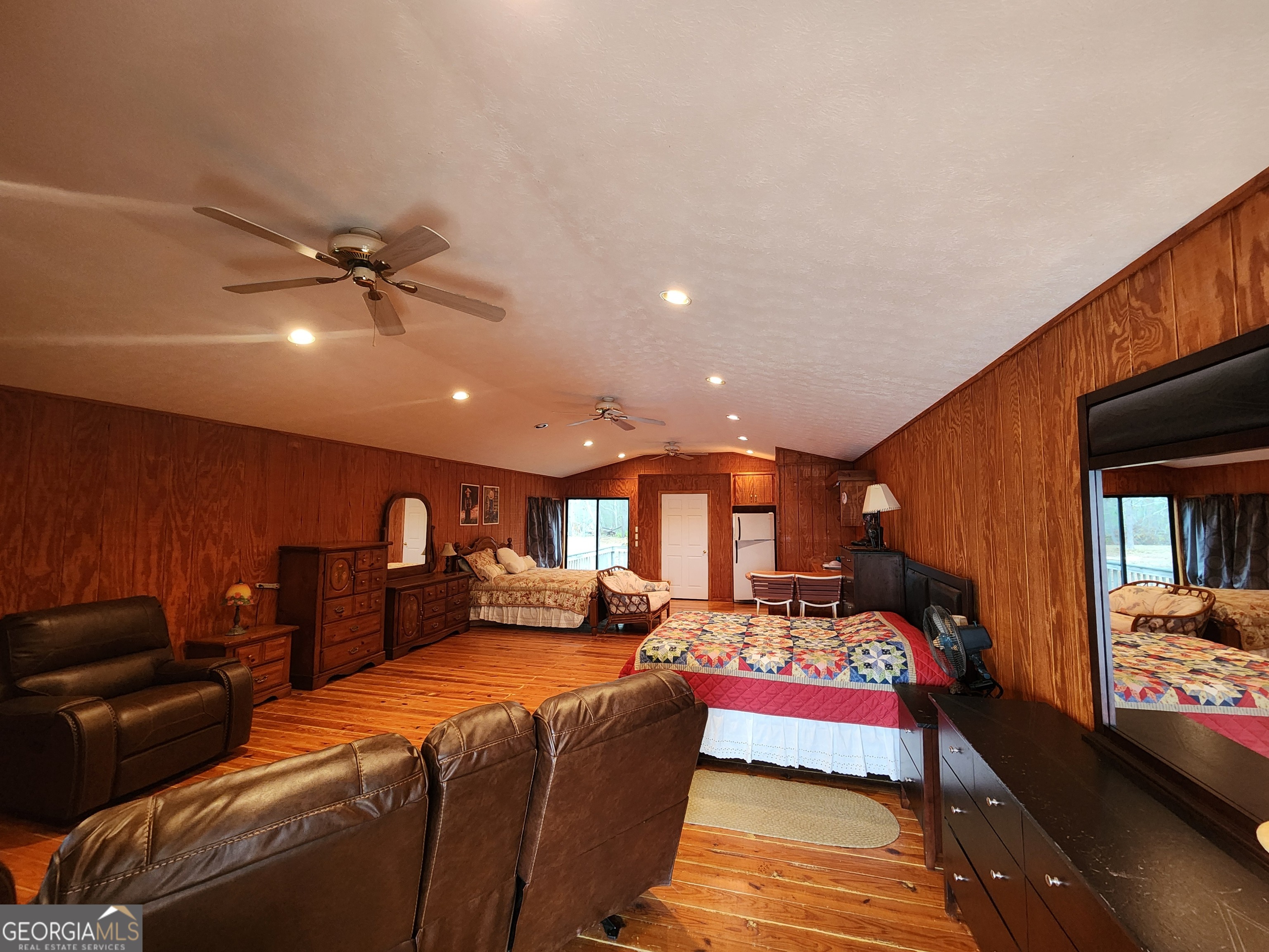 0 Hammond Powell Road Hazlehurst, GA 31539 - Photo 20 of 45 a bedroom with a bed and a chandelier