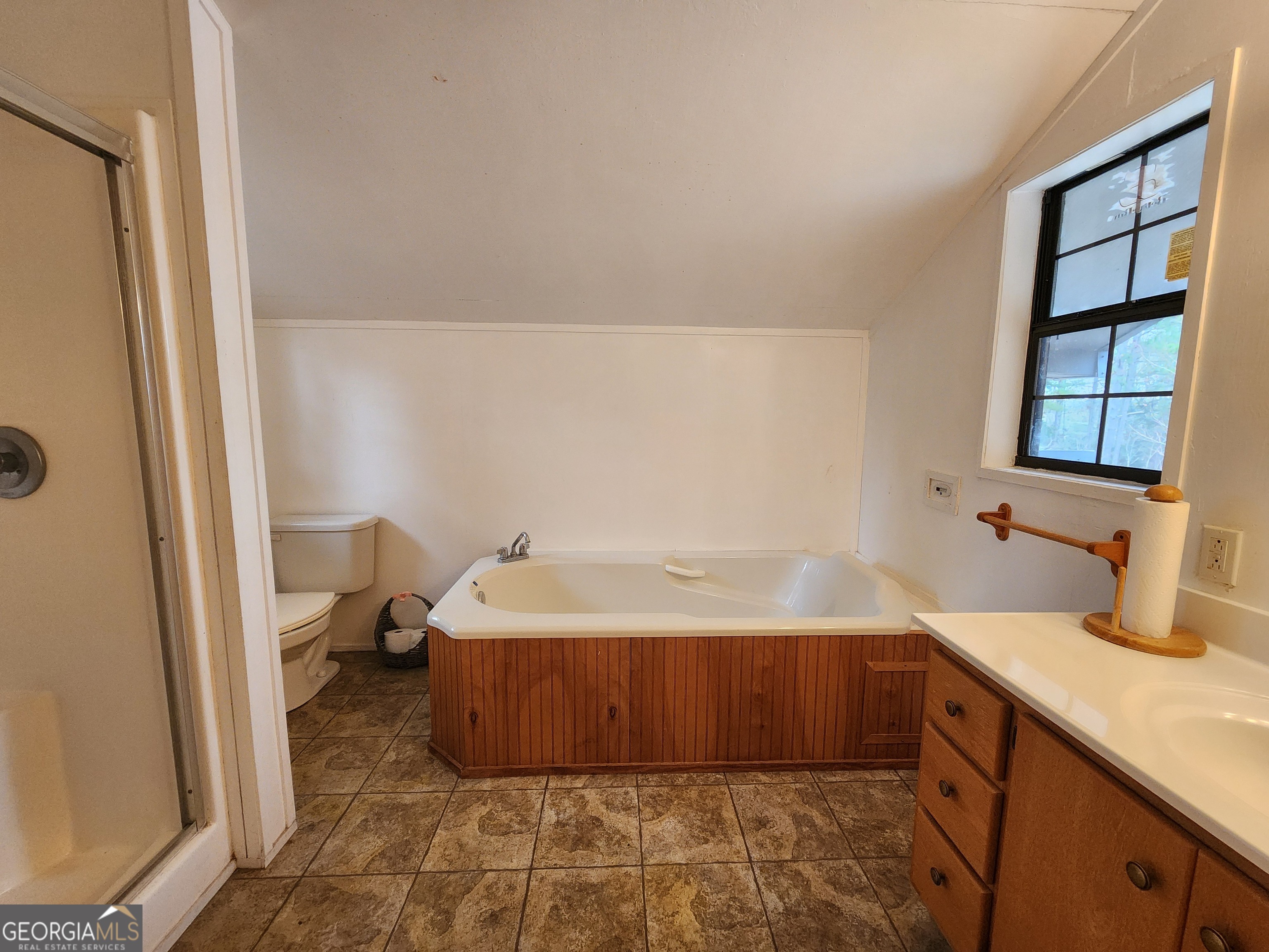 0 Hammond Powell Road Hazlehurst, GA 31539 - Photo 26 of 45 a spacious bathroom with a bathtub and shower