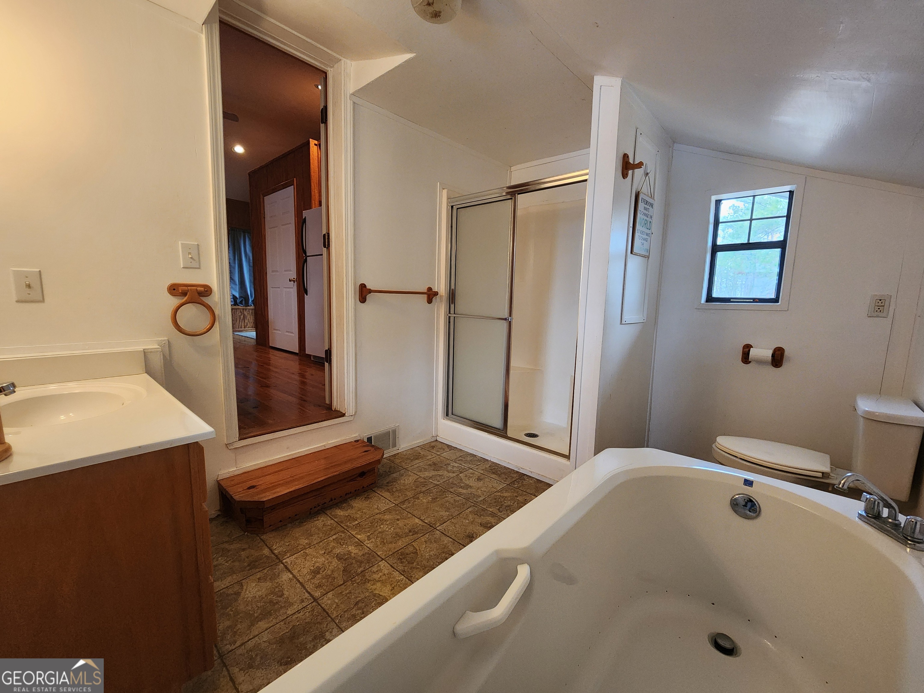0 Hammond Powell Road Hazlehurst, GA 31539 - Photo 27 of 45 a bathroom with a tub sink and mirror