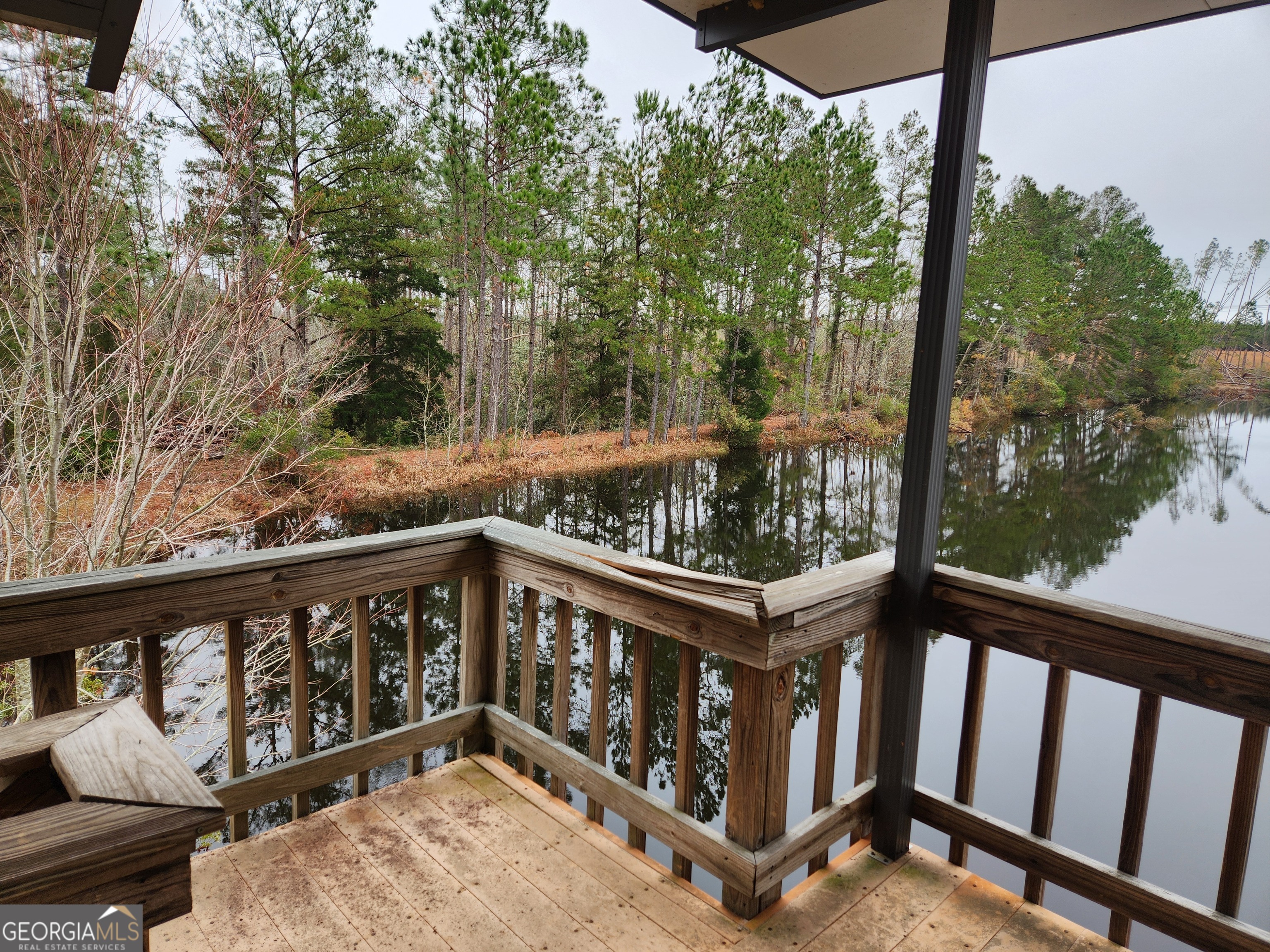 0 Hammond Powell Road Hazlehurst, GA 31539 - Photo 31 of 45 a view of a wooden deck with trees in the background